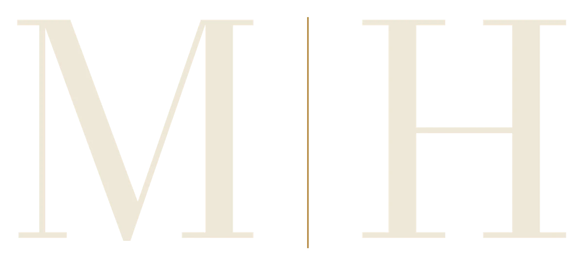 Member's Hour monogram, M and H divided by a gold line
